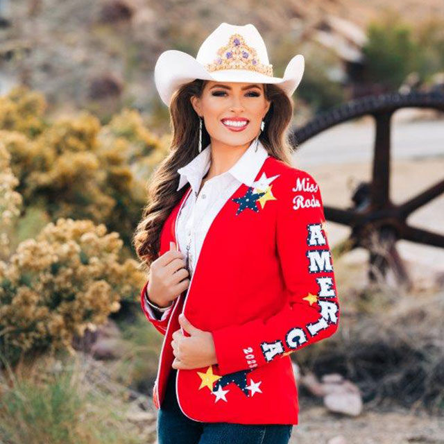 Miss Rodeo America wearing a red jacket that says Miss Rodeo America